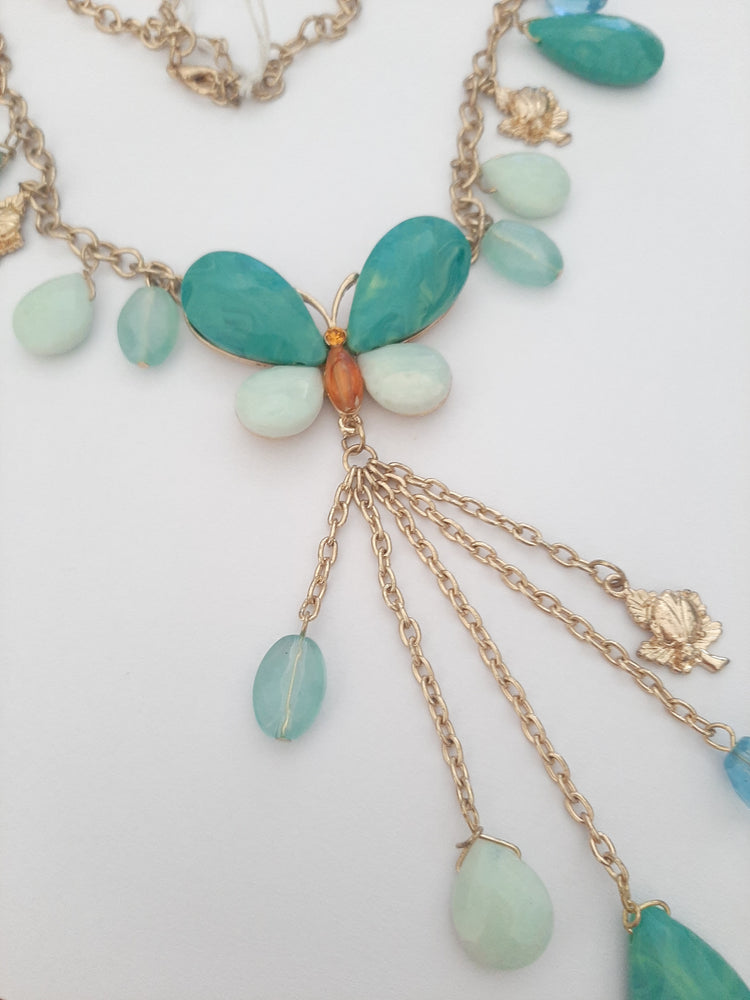 Women's blue butterfly necklace in gold tone metal