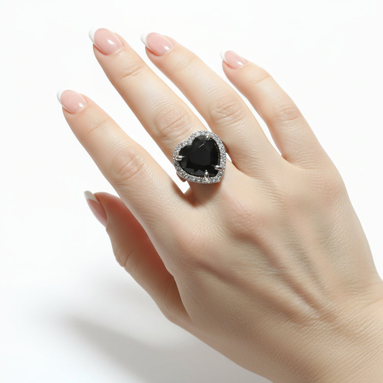 Large women's silver tone ring with purple tone stones