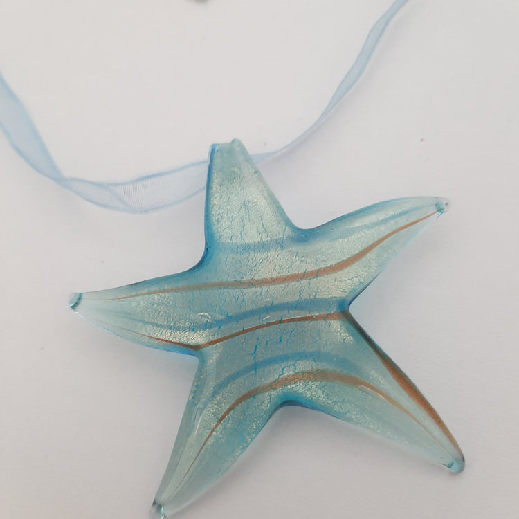 Starfish pendant necklace in blue glass