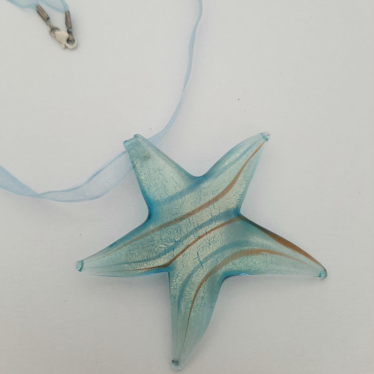 Starfish pendant necklace in blue glass