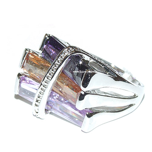 Large women's silver tone ring with purple tone stones