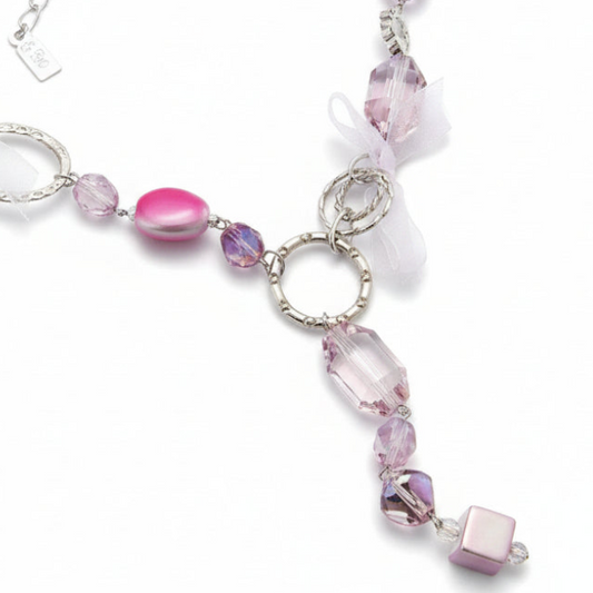 Long women's necklace in silver tone hypoallergenic metal with pink stones and bows