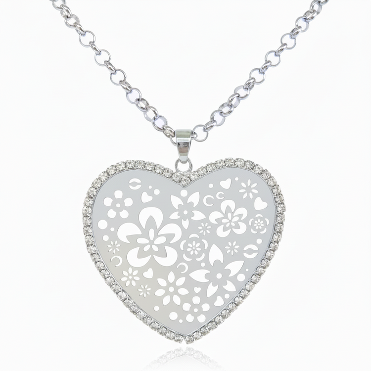 Long openwork heart pendant necklace with silver tone rhinestones