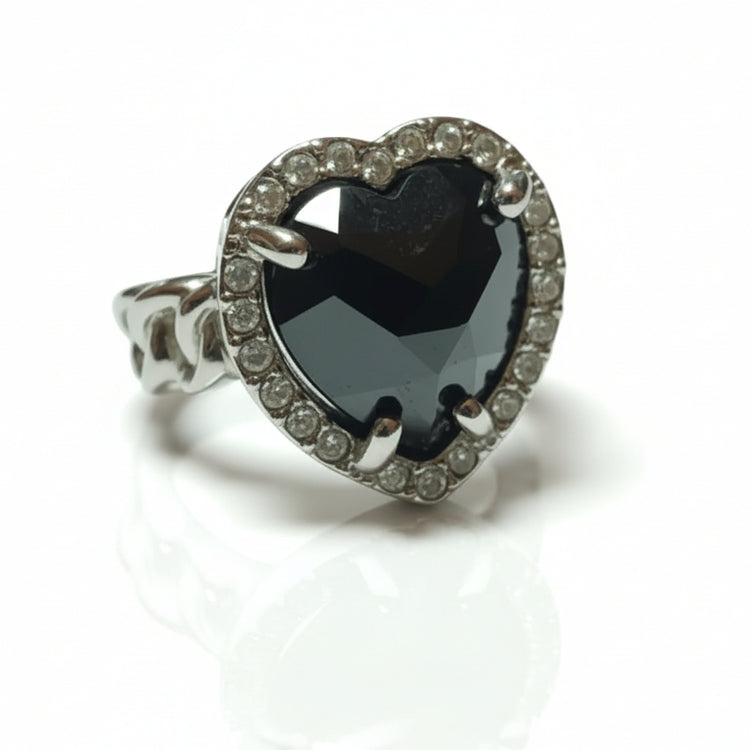 Large women's silver tone ring with purple tone stones